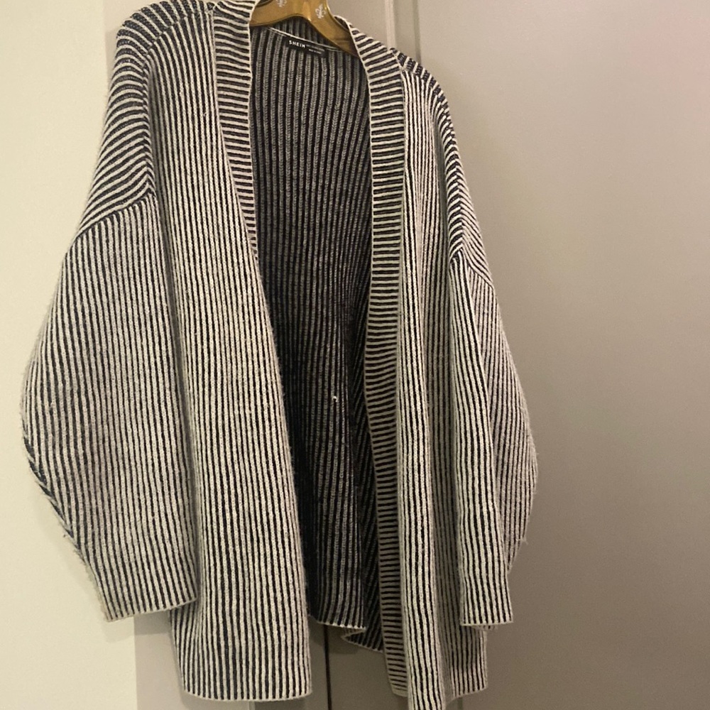 Cozy knit open collar sweater perfect for a rainy or breezy day.